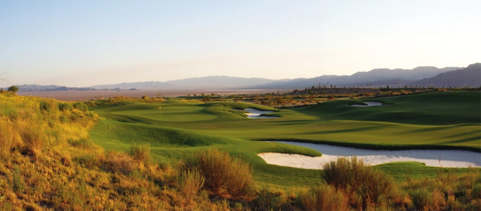 View of bunker and golf course from top of hill